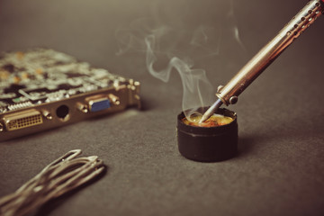 soldering iron melts rosin close up