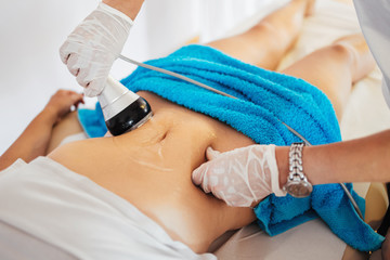 Cavitation RF body treatment and contemporary medicine for health beauty improvement and fat and cellulite removal - obrazy, fototapety, plakaty