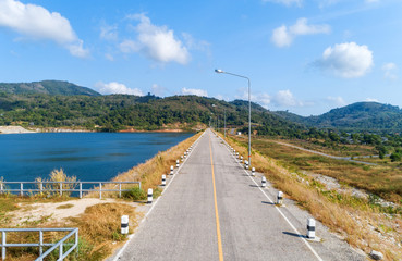 Asphalt road with yellow line on road image by drone camera high angle view.