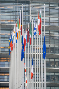 STRASBOURG, FRANCE - DEC 11, 2018: Vertical image of EU and French Flag flies at half-mast in front of the European Parliament following an attack in center of Strasbourg 