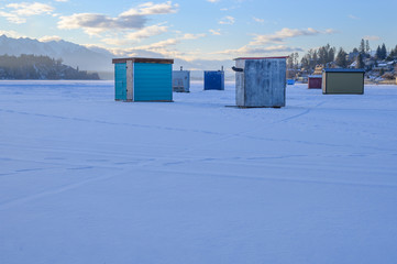 Ice fishing shacks on Lake Windermere at the town of Invermere, British Columbia, Canada