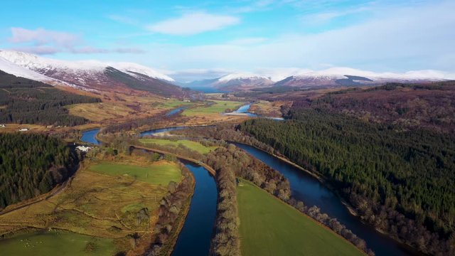 aerial drone footage of the caledonian canal and fort william in the argyll region of the highlands of scotland on a clear blue winter day