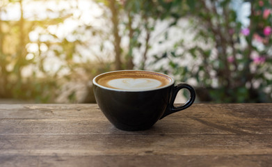 cup of coffee on wooden table