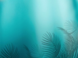 Fototapeta na wymiar dappled of shadow leaf on turquoise background design concept in underwater with sea