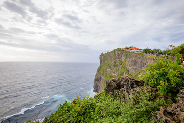 A view of Idian Ocean from Bali, Indonesia. Beautiful blue ocean water and a hanging cliff by the sea