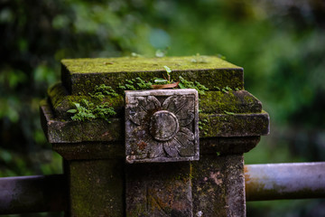 Balinese sculptures and architectural details in a temple, antique and rich of local culture