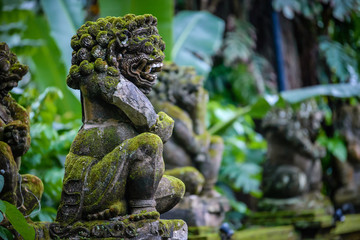 Balinese sculptures and architectural details in a temple, antique and rich of local culture