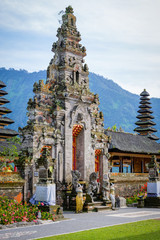 Balinese sculptures and traditional architectural details in a temple in Bali, Indonesia
