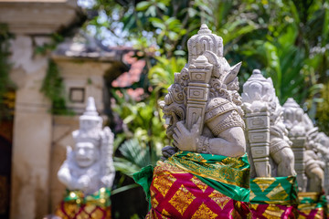 Balinese sculptures and traditional architectural details in a temple near Ubud, Bali, Indonesia