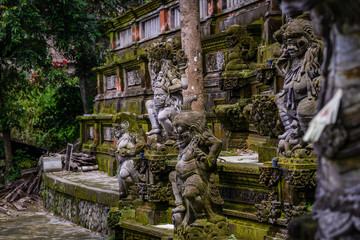 Balinese sculptures and traditional architectural details in a temple near Ubud, Bali, Indonesia