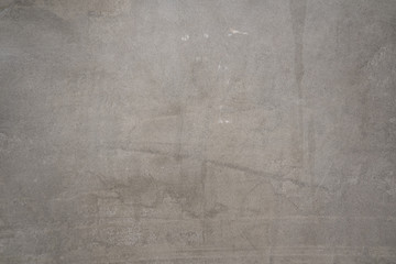 Retro or loft style cement concrete wall in gray color. Background, texture and wallpaper pattern photo.