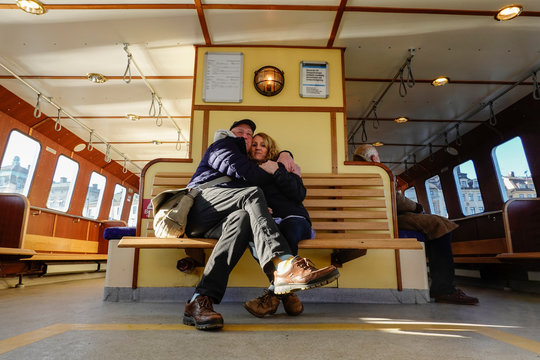 Stockholm, Sweden A couple hugging aboard the Djurgårdsfärjan (Djurgården ferry)