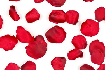 Red fabric rose petals on white background top view from above - marriage, love, wedding or valentine's day background