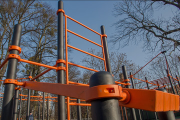 Sports facilities: inclined plane, gymnastics wall bars and set of horizontal bars in black and...