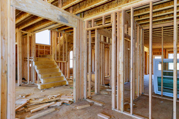 Large wooden beams timber frame interior view of a house under construction