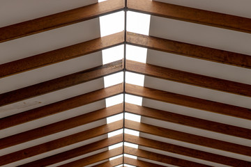 The inner roof consists of wooden beams and lets natural light through in the middle