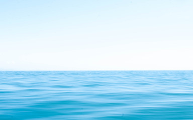 Smooth surface of the ocean and blue sky Use techniques panning and low shutter speeds