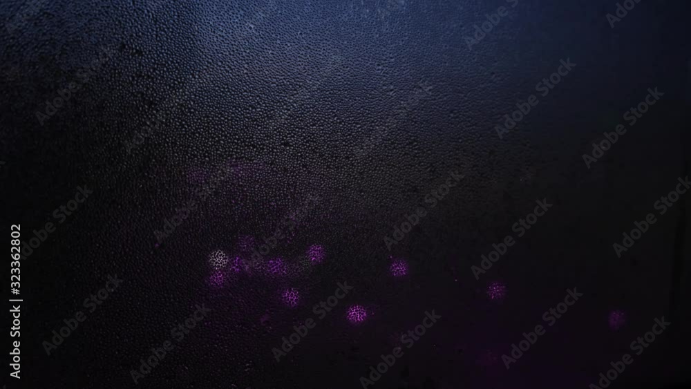 Poster close-up of window with raindrops on blurred background of lights. concept. dim lights shine through