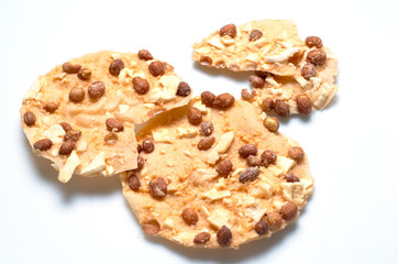 Thai snack-fried peanut with wild yam on the isolated white background