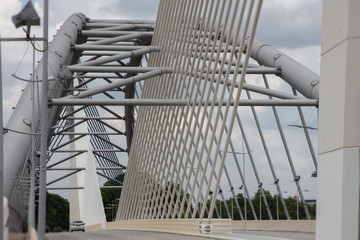 Naklejka premium Close to the Seri Saujana Bridge in Putrajaya, Malaysia the Malaysian Government city 40 km outside of Kuala Lumpur. Close up to the steel cable structure of the Putrajaya bridge. 