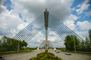 Fototapeta premium Close to the Seri Saujana Bridge in Putrajaya, Malaysia the Malaysian Government city 40 km outside of Kuala Lumpur. Close up to the steel cable structure of the Putrajaya bridge. 