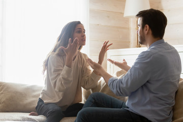 Angry millennial couple have troubles dispute at home