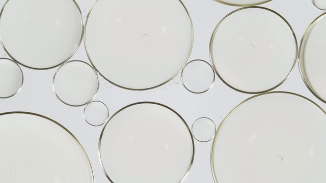 Bubble oil flowing on water surface