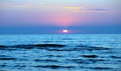 Obraz premium Sunset in blue tones above the Baltic sea, Jurmala, Latvia