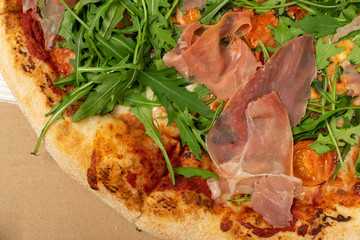 Pizza with Tomatoes, Prosciutto, Arugula and Mozzarella