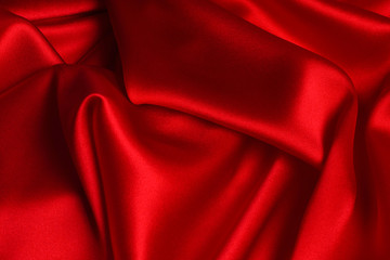 Red silk or satin luxury fabric texture can use as abstract background.