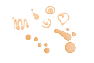 Liquid foundation swatch isolated on white background. Close Up of makeup cream sample.
