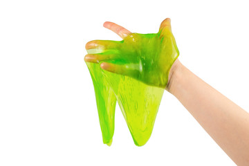 Green slime toy in woman hand isolated on white.