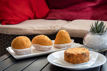 Arancino or arancina, tipical and traditional sicilian street food.  Delicious rice balls made with fried rice.