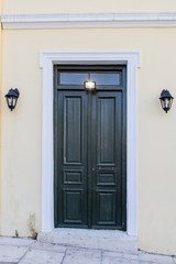 Front door with small square decorative windows