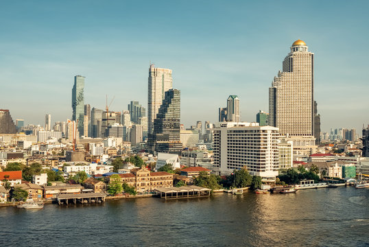 Bangkok skyline and business skyscrapers at Chaopraya river
