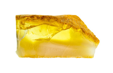 rough amber gem stone cutout on white