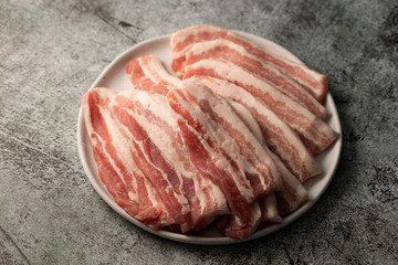 Pork belly on white plate 