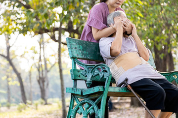 Insane asian woman would hurt her senior mother covering mouth,nose,daughter who is bored with...