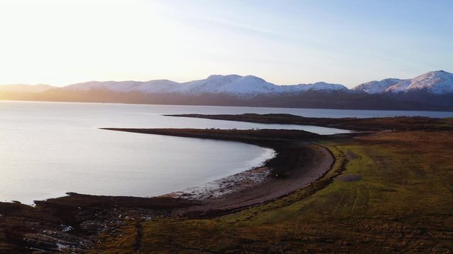 aerial drone footage of loch linnhe and cuil bay in the argyll region of the highlands of scotland near glencoe during a winter day