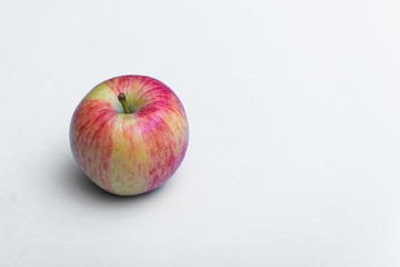 Fresh rustic apple on a white background
