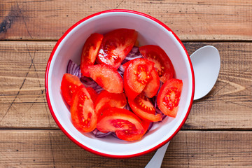 Step-by-step preparation of salad with tomatoes, chickpeas and red onions, step 3 - adding chopped...
