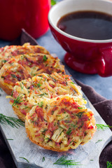 Hot sandwiches with potatoes and sausage without cheese, cooked in a pan, selective focus