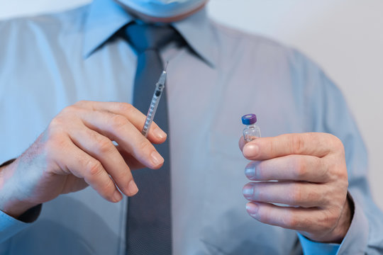 Coronavirus quarantine and Air pollution pm2.5 concept. Old sick man wearing respirator mask for protect holds syringe and medicine for injection. Wuhan, China epidemic virus symptoms background.