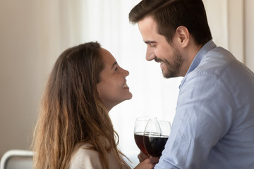 Happy young couple enjoy romantic dinner at home