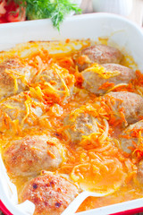 Baked homemade meat patties with onions and carrots, selective focus