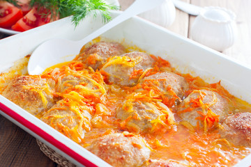 Baked homemade meat patties with onions and carrots, selective focus