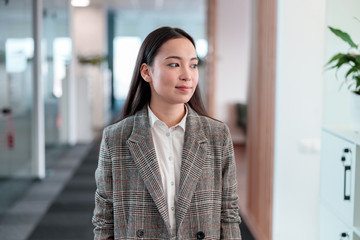 Asian young woman is woking in office