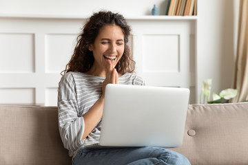 Overjoyed young woman feeling excited about good news.