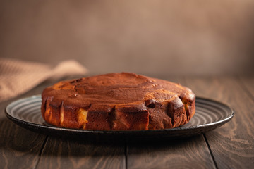 Homemade baking. Fragrant zebra cake with a crispy crust on a plate with coffee and chocolate