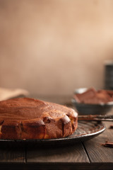 Homemade baking. Fragrant zebra cake with a crispy crust on a plate with coffee and chocolate